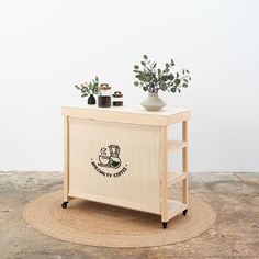 a small table with some plants on top