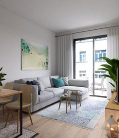 a living room filled with furniture and a flat screen tv sitting on top of a wooden table