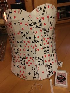 a paper corset made to look like playing cards