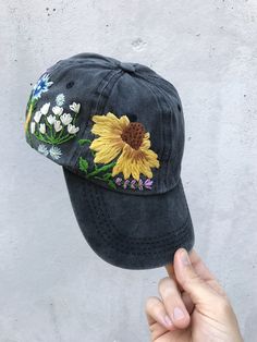 Hand Embroidered Hat is the best gift for her! 🌿 PLEASE NOTE THIS HAT IS READY TO SHIP🌿 Color: a black baseball cap. Design: hand embroidered echinacea with wildflowers. Cap size (head circumference): 55 - 62 cm. GET 10% OFF YOUR 1ST ORDER! Get a 10% off coupon code for our Etsy shop by signing up to our mailing list eepurl.com/gefZy5 CHECK OUR OTHER ACCESSORIES 🌸More Baseball hats: https://www.etsy.com/shop/KazkovaEmbroidery?ref=seller-platform-mcnav&section_id=25392998 🌿Kids Baseball h Baseball Cap Design, Custom Embroidered Hats, Embroidery Hat, Hat Flower, Pretty Hats, Head Gear, Hat Custom, Black Baseball Cap, Yarn Thread