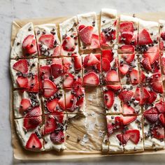 sliced strawberries and chocolate on top of a cookie sheet