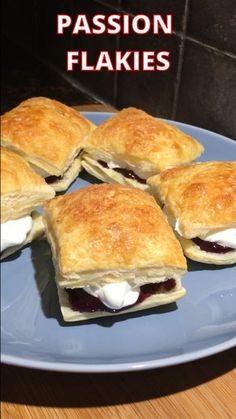 four pastries on a blue plate with the words passion flakies above them