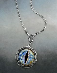 "Frost Dragon Eye Steampunk necklace (Listing 94) Amaze your friends at your next RuneScape or D&D session with this colorful Frost Dragon Eye necklace! It's been set into an Art Nouveau styled necklace for a unique bit of Victorian Steampunk vibe. We have 5 chain length available at checkout (18\", 21\", 24\", 27\" or 30\") and custom lengths are available upon request. Pendant measures 1-3/16\" across (30mm) and the artwork is covered by a crystal clear, domed glass cabochon which protects Sea Turtles Art, Dragon Eye Necklace, Frost Dragon, Sea Turtle Jewelry, Lily Necklace, Art Nouveau Necklaces, Sea Turtle Art, Monet Water Lilies, Monet Art