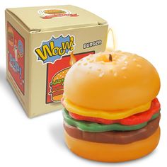 a toy hamburger is in front of a box