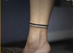 a woman's foot with a small tattoo on the side of her left ankle