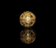 "22K gold vermeil plated Sterling Silver granulation bead, a mix of modern and traditional Balinese style. The weight is 8.05 grams. Hole to Hole size is 24mm. More valuable and durable than gold plating, \"vermeil\" jewelry has a thicker layer of gold covering (over 2.5 microns), and by definition has a sterling silver base. Granulation is an ancient jewelry manufacturing technique whereby a surface is covered in spherules or granules of precious metal, usually gold and/or silver alloys of high Ornate Gold Round Beads Jewelry, Ornate Gold Round Bead Jewelry, Ornate Gold Round Beaded Jewelry, Antique Gold Jewelry With Spacer Beads, Gold Hallmarked Round Beads Jewelry, Antique Gold Jewelry With Polished Beads, Gold Hallmarked Jewelry With Round Beads, Gold Jewelry With Intricate Round Beads, Gold Jewelry With Spacer Beads For Anniversary