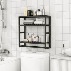 a bathroom with white tiles and black shelving