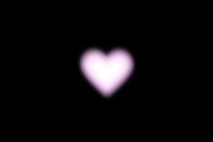 a blurry image of a heart in the dark