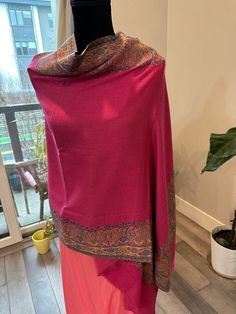 This Kashmiri pashmina shawl is super soft and is a perfect gift to own or for a return favor. The shawl is around 2.15 m in length and is a pink shade. Bordered with paisley motifs, the shawl is great for all seasons and of course for the winter. Can be worn on sarees as well. Beautiful Kashmiri pashmina shawls with paisley weaving | pashmina stole | pashmina scarf | return gift | favors | pashmina shawl online shopping | indian ethnic | gift for her | Kashmiri shawls Gift Favors, Kashmiri Shawls, Return Gift, Stole Scarf, Pashmina Shawl, Pashmina Scarf, Shawls And Wraps, Scarf Wrap, Hand Embroidery