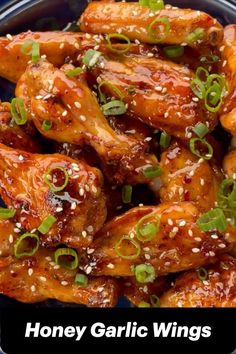 honey garlic wings with sesame seeds and green onions