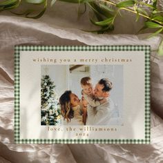 a christmas card with an image of a family