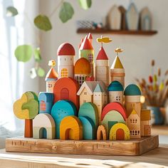 a wooden toy castle sitting on top of a table