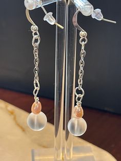 Dangle Earrings with crystal glass bead and freshwater pearl hangs from 2inch chain. Looks elegant and classy with any wardrobe.  Beautiful set to give as a gift or for yourself to wear at a special event. You will look beautiful in this set of earrings. Feel pretty and classy at the same time. Elegant Glass Drop Jewelry, Elegant Drop Glass Jewelry, Elegant Drop-shaped Glass Jewelry, Elegant Long Drop Crystal Earrings With Dangling Beads, Elegant Dangle Glass Jewelry, Elegant Glass Drop Earrings, Elegant Glass Dangle Jewelry, Elegant Glass Crystal Drop Earrings, Elegant Nickel Free Glass Earrings