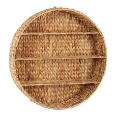 a round wicker shelf with three shelves