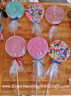 candy lollipops are on sticks in clear bags