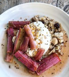 a white plate topped with food on top of a wooden table