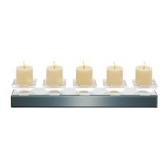 six candles sitting on top of each other