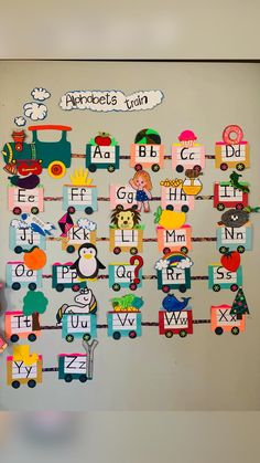 a bulletin board with letters and animals on it