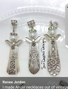 three pieces of jewelry sitting on top of a white plate