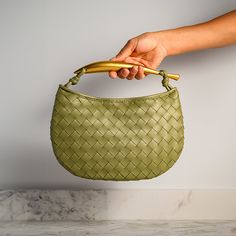 The Zarah Handbag will be discontinued today at 11:59 PM PST The Zarah Handbag is a fusion of artistic patterns, innovative design, and quality craftsmanship. Its woven patterns create a unique texture and design that sets it apart. Its stunning gold handle is more than just an accent; it's a fashion-forward feature that adds a touch of modern chic. Step out into the world and stand out with the Zarah Handbag! Now available in beige, off-white, pink, lime brown, gray, wine red, caramel, and blac Bangle Ring, Bohemian Look, Gold Handles, Crossbody Clutch, Medium Tote, Modern Chic, Innovative Design, Love Ring, Bag Set