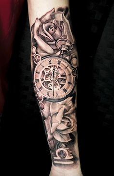 a man's arm with a clock and roses on it