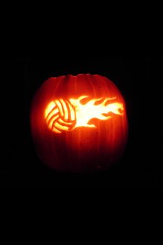 a carved pumpkin with flames on it