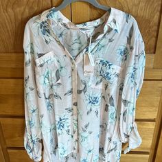 This Beautiful Floral Blouse Is New With Tags. It Is Light Pink With Blue, Mint, Green And Gray Flowers. It Is Very Sheer And Light Weight. Casual Floral Print Shirt For Loungewear, Casual Floral Print Loungewear Shirt, Pink Casual Blouse For Loungewear, Spring V-neck Shirt For Loungewear, Pink Shirt For Spring Loungewear, Pink Semi-stitched Floral Print Blouse Piece, Light Blue V-neck Blouse With Floral Print, Pink Floral Print Button-up Blouse, Spring Long-sleeve Multicolor Print Blouse