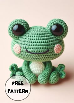 a crocheted frog sitting on top of a pink surface with the caption free pattern