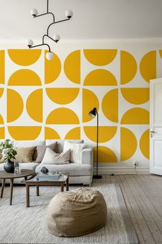 a living room with yellow and white wallpaper