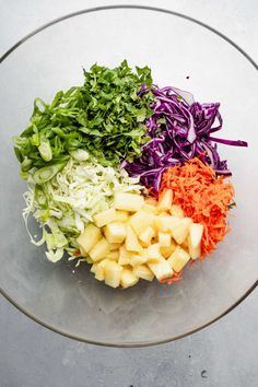 chopped up vegetables are in a glass bowl