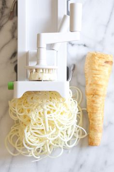 the pasta is being made with a vegetable slicer