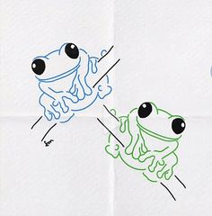 two different colored drawings of frogs on white paper