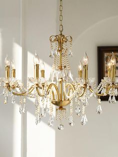 a chandelier hanging from the ceiling in a room