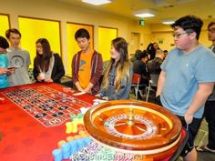 a group of people standing around a roule