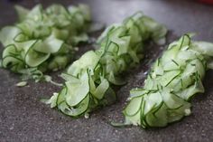 several pieces of lettuce on a counter top