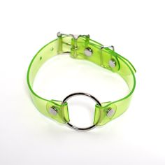 Classic o-ring collar in candy-colored PVC. Fit is adjustable with buckle. Collar is 3/4" wide, with a 1.25" o-ring. Shown in Lime Green PVC. Also available in Neon Pink and Neon Orange (both are UV/Blacklight reactive!) SMALL/MEDIUM (11-13")MEDIUM/LARGE (13-15")LARGE/X-LARGE (15-17") Custom sizing available. All pieces are MADE TO ORDER. If your measurements fall outside these standards or you are unsure of what size to order, select "CUSTOM" and include your measurements in the notes upon chec Neon Clothes, Neon Accessories, O Ring Choker, Rave Fashion, Uv Reactive, Choker Collar, Jewelry Inspo, Neon Orange, Piercing Jewelry