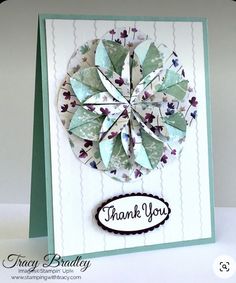 a handmade thank you card with an origami flower