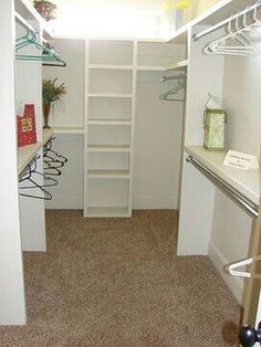 the small walk - in closet is clean and ready for us to use