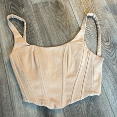 Tan Vici Bustier Size Small Never Worn Fitted Sleeveless Beige Crop Top, Beige Fitted Sleeveless Crop Top, Fitted Cropped Beige Tank Top, Fitted Beige Tank Top, Fitted Beige Tank Top With Straps, Chic Fitted Beige Crop Top, Spring Beige Fitted Corset, Fitted Beige Spring Corset, Beige Fitted Corset For Spring