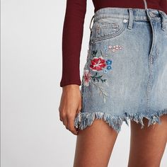 This Denim Mini Skirt Is A Twist On A Classic Thanks To A Frayed Hem And A Pop Of Floral Embroidery. Pair With A Fitted Top Or Bodysuit For A Fun, Fresh Casual Look. Mid Rise Denim Mini Skirt One Button Closure With Zip Fly; Five Pocket Styling Floral Embroidery; Medium Wash Frayed Hem; Mini Length Cotton Machine Wash New With Tags Floral Embroidered Cotton Denim Skirt, Embroidered Denim Skirt For Spring, Casual Denim Skirt With Floral Embroidery, Casual Embroidered Mini Skirt For Spring, Spring Embroidered Denim Skirt, Casual Embroidered Fall Skirt, Summer Floral Embroidered Denim Skirt, Casual Embroidered Denim Blue Skirt, Spring Mini Skirt With Floral Embroidery