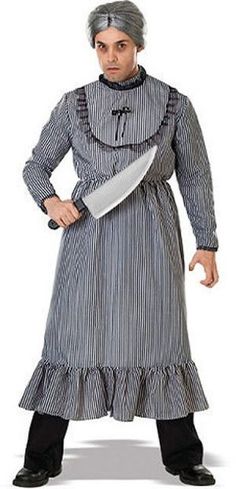 a man dressed in an old fashioned costume holding a large knife and looking at the camera