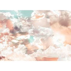 the sky is filled with white clouds and pinkish hues in shades of blue