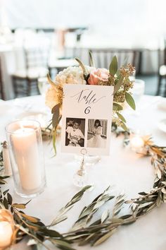 the table is set with candles and flowers