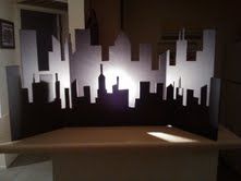 an image of a cityscape made out of cutouts on a table top