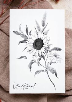 a card with a drawing of a sunflower on it