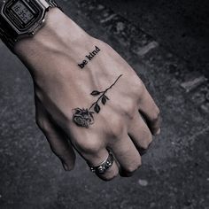 a person's hand with a tattoo on it