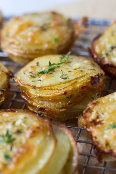 some food is sitting on a wire rack and ready to be cooked in the oven