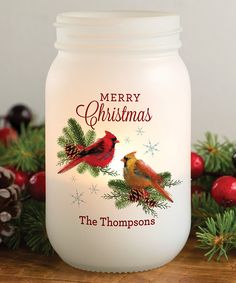 a christmas jar with two birds on it