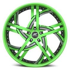 a green wheel with black spokes is shown