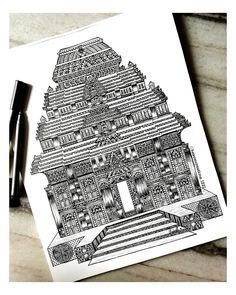 an ink drawing of a building on paper with a pen next to it and two pens